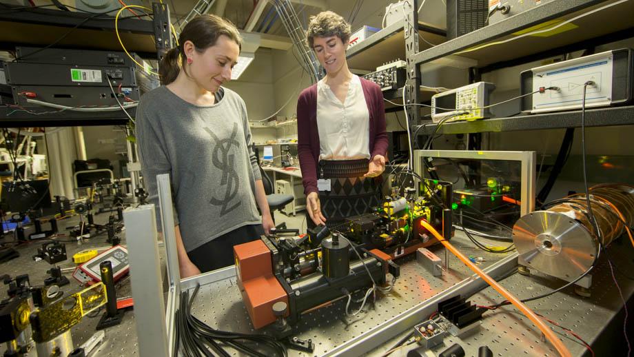 Dr Rose Ahlefeldt (right) in her lab at the ANU Research School of Physics and Engineering. Photo by Lannon Harley.