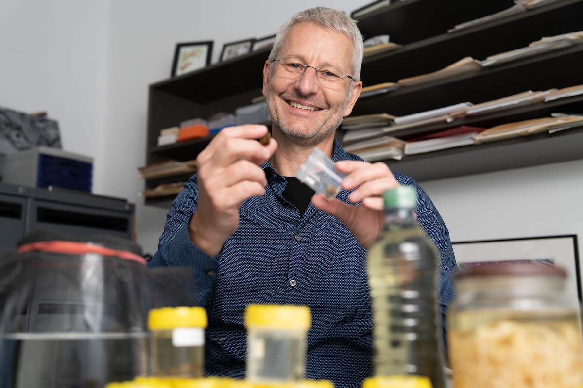 Man in office with jars