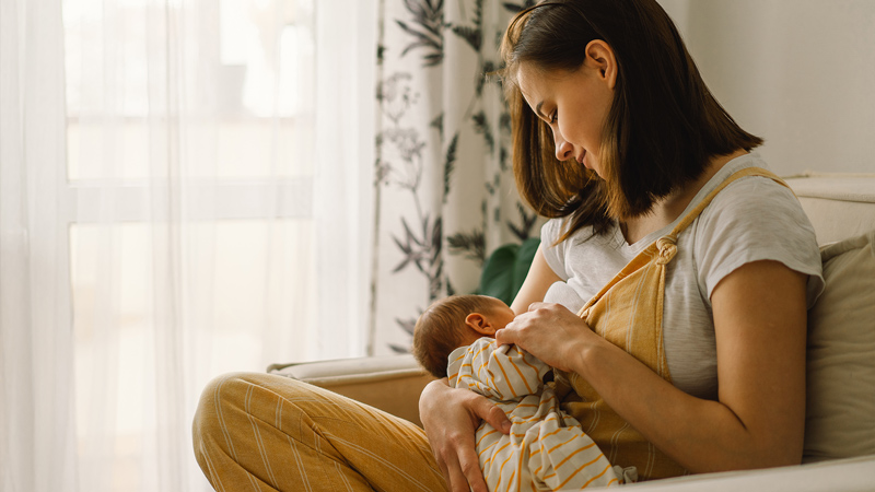 A woman breastfeeding her baby