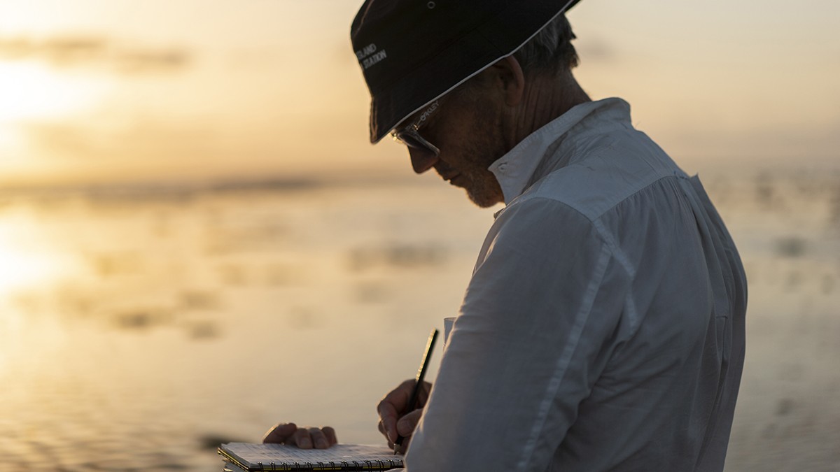 Researcher, Professor Stephen Eggins, on the reef flat at sunset.