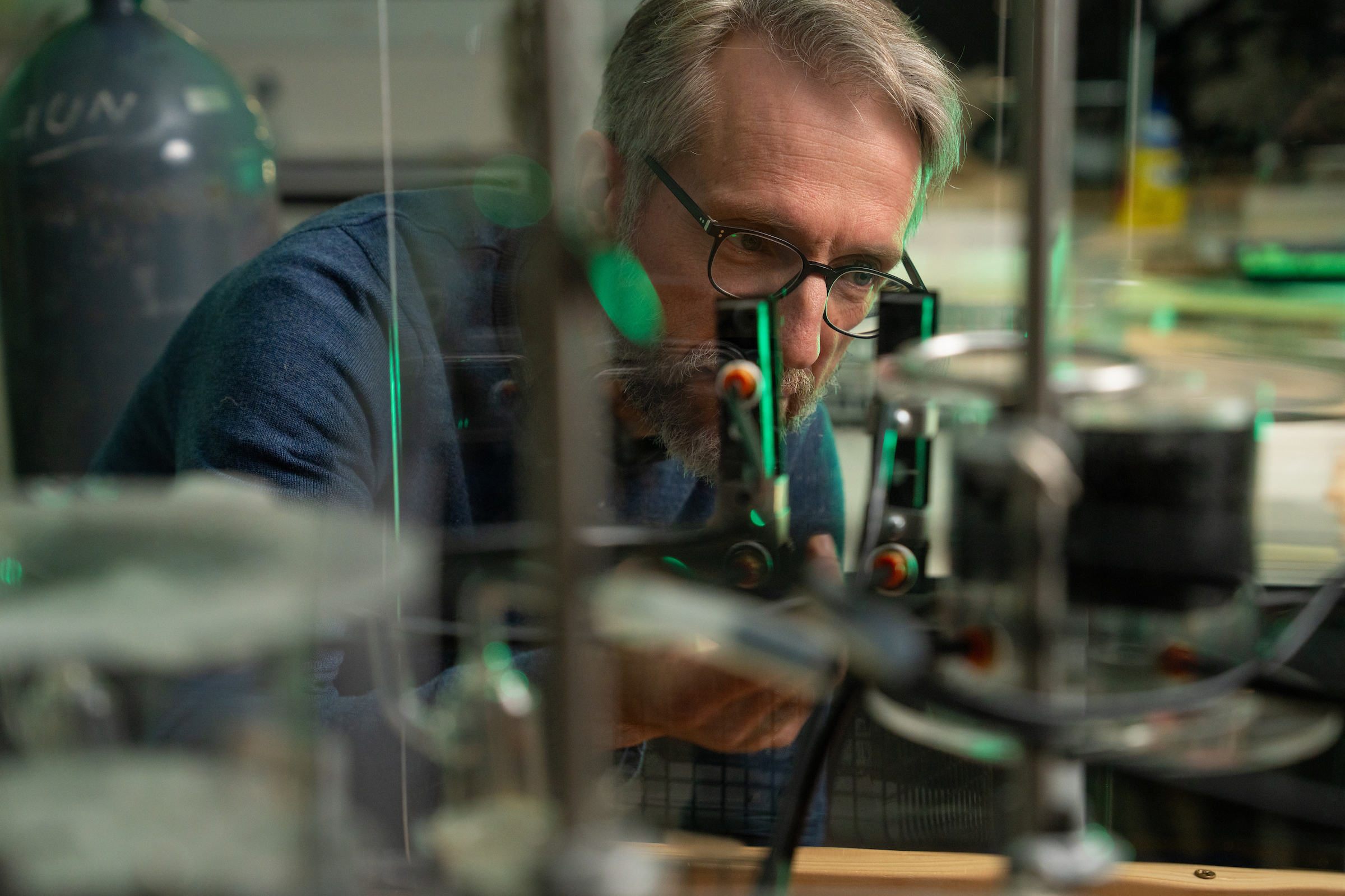 A man is looking at scientific equipment.