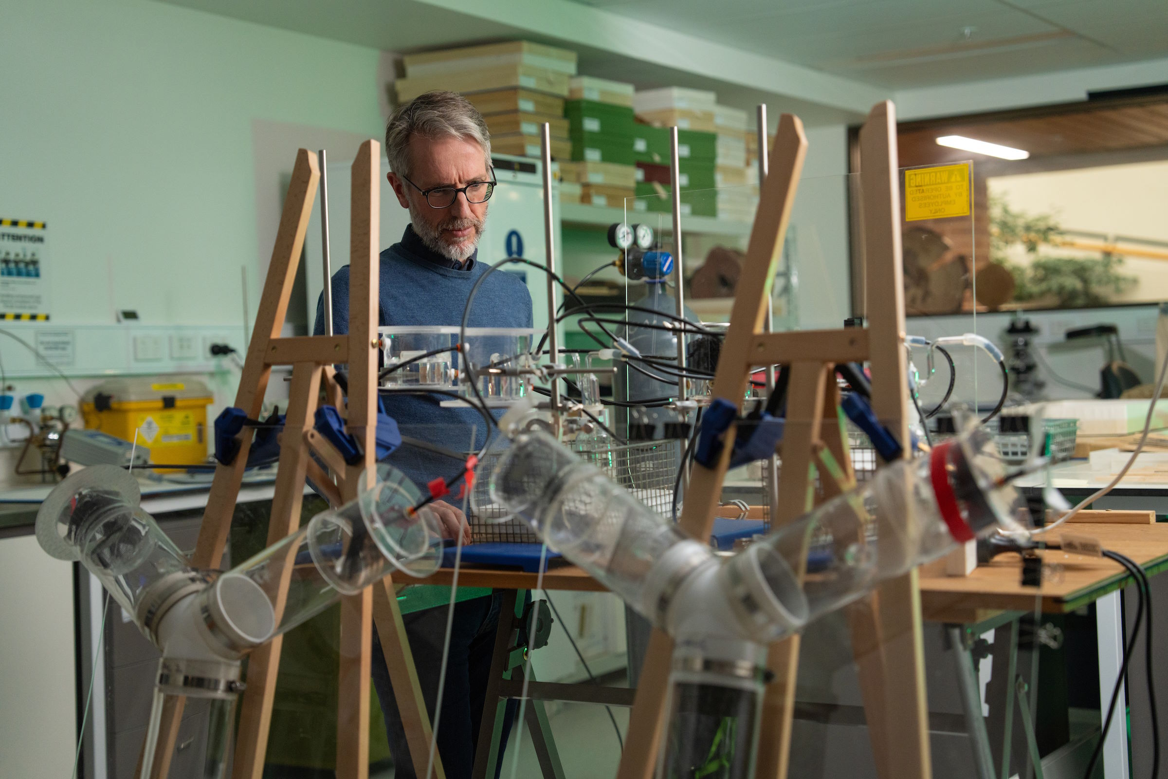 A man is looking at scientific equipment.
