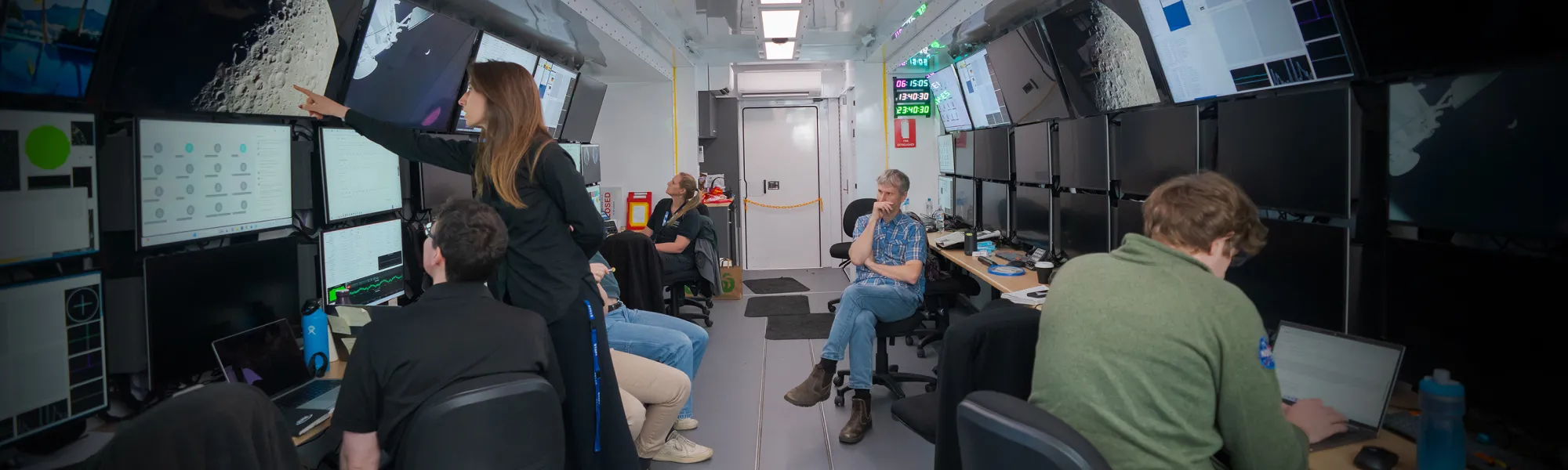Photo of people inside a space communication command centre