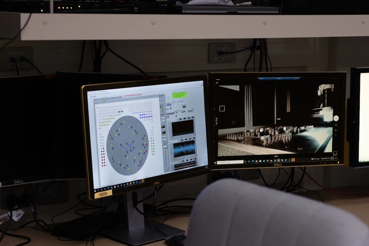 From the control room, you can watch the robot set up the plates for Hector. Photo: Nic Vevers/ANU Computer monitors
