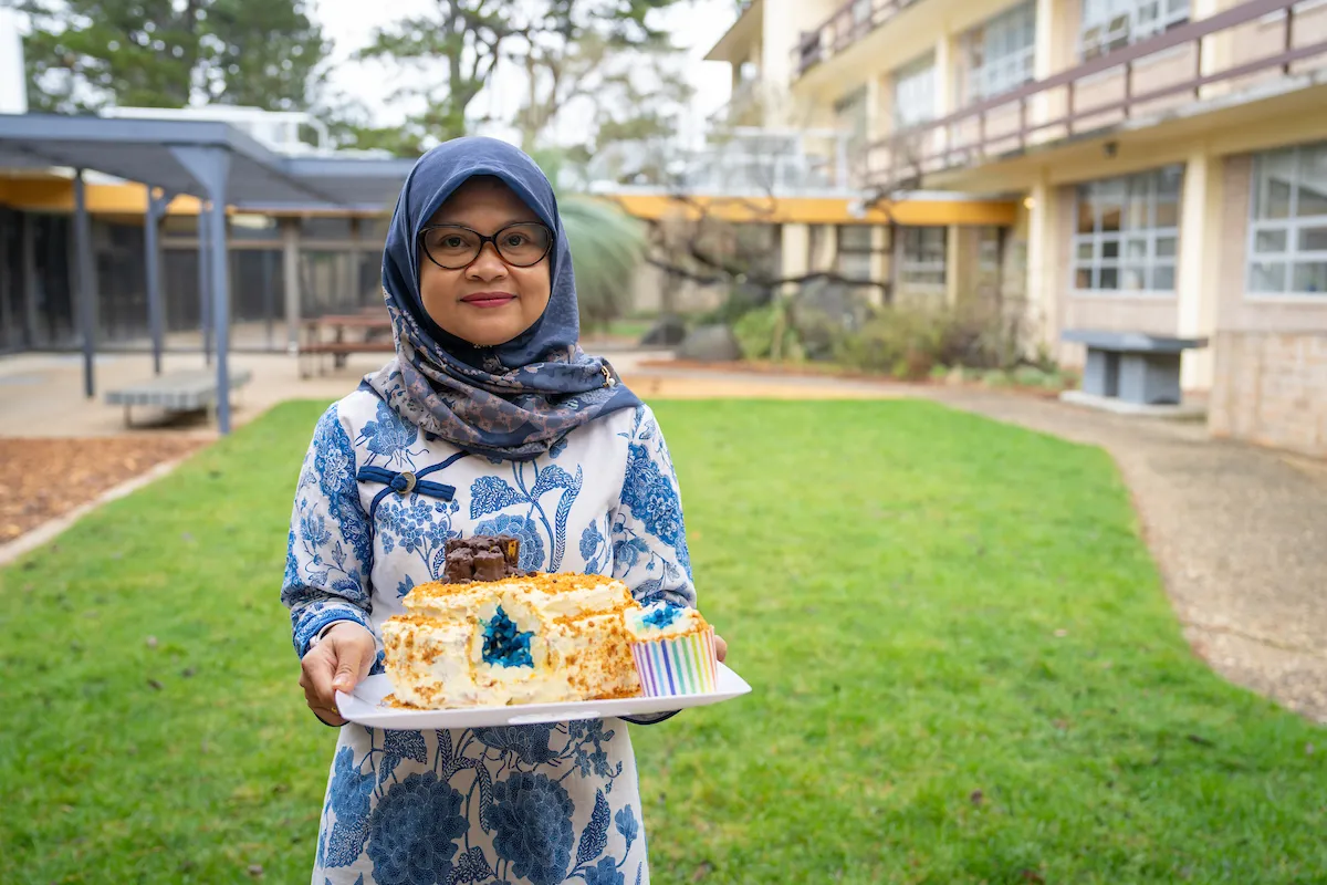 Bake Your PhD winner, Rosmalia Nugraheni. Photo: Nic Vevers/ANU Woman holding a cake