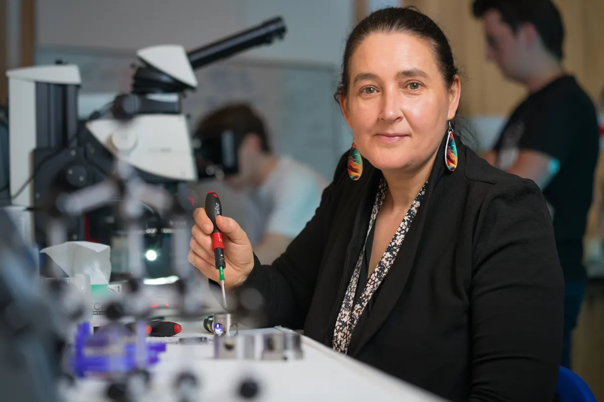 Woman by a microscope