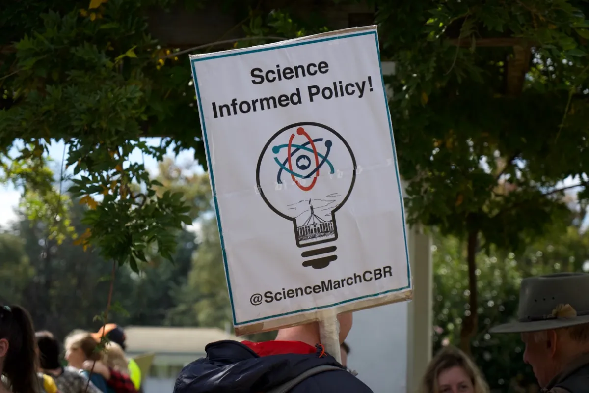 Sign held by a marcher that says 'Science Informed Policy'