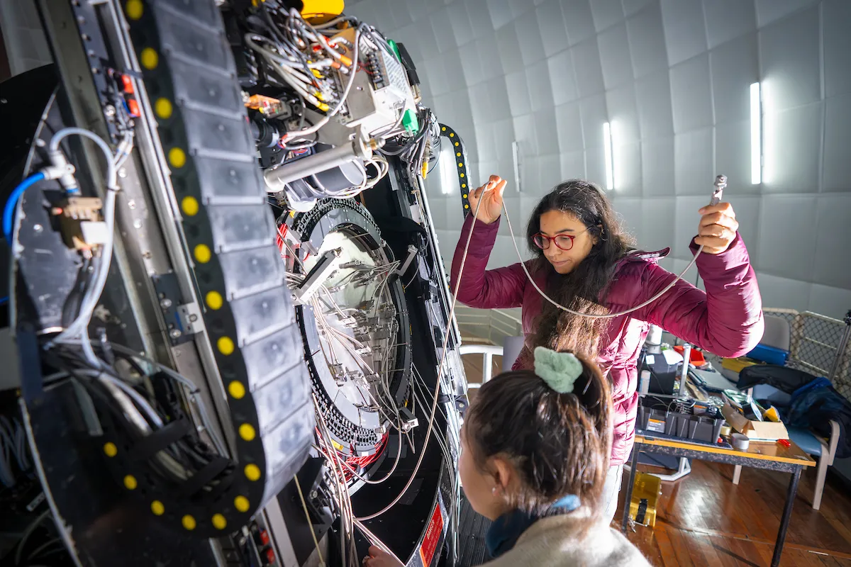 Changing the plate on the instrument, Hector, of the AAT. Photo: Nic Vevers/ANU Hector