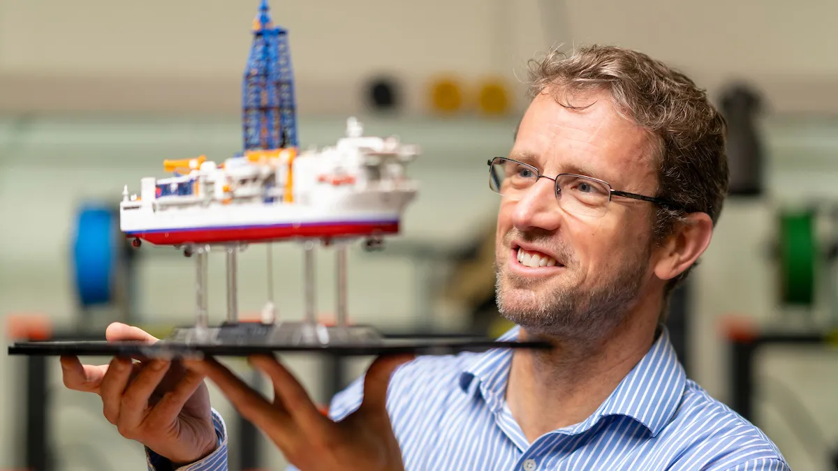 Man with model ship.