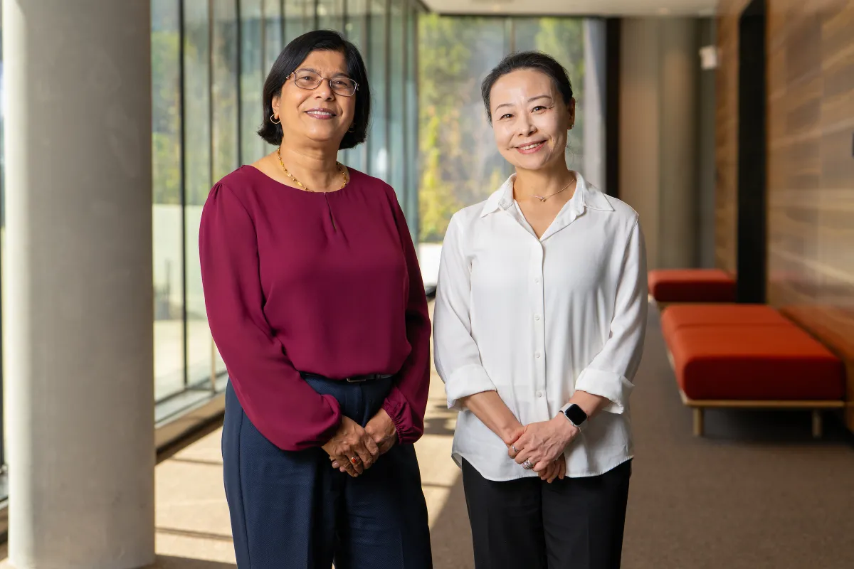 ANU researchers Professor Mahananda Dasgupta (left) and Professor Lan Fu (right) are pictured in a foyer