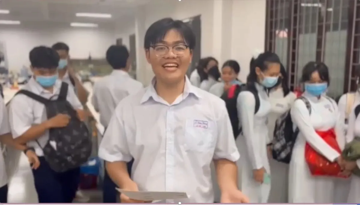 A student looking at the camera