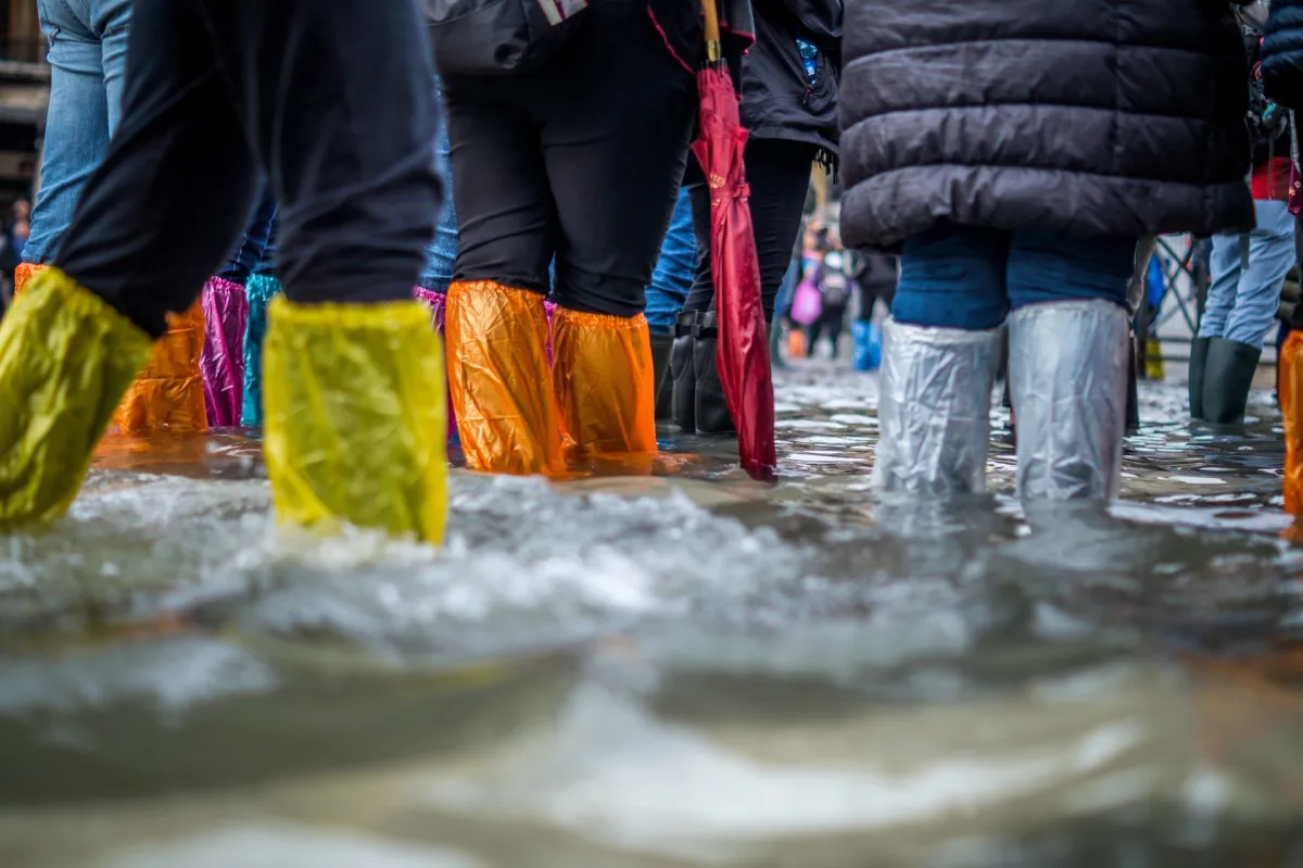 People's gumboots in a flood