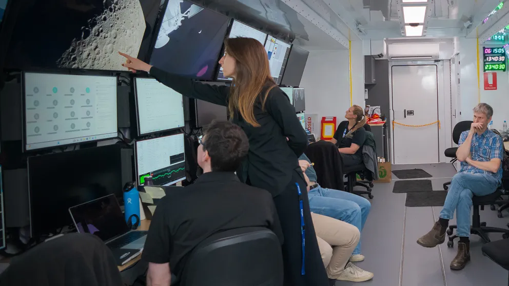 Photo of people inside a space communication command centre