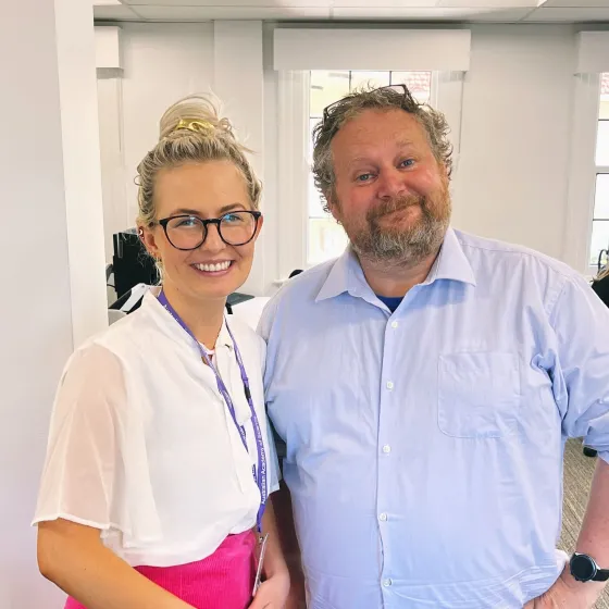 Two people smiling
