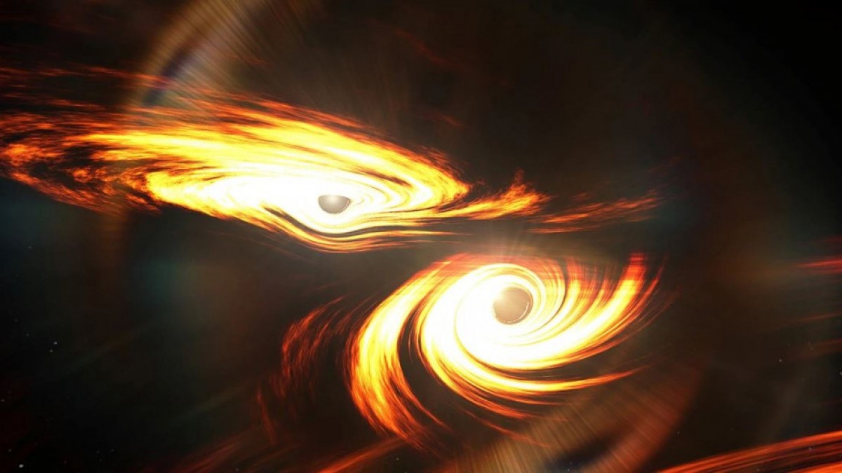 Artist impression of two black holes colliding in space.