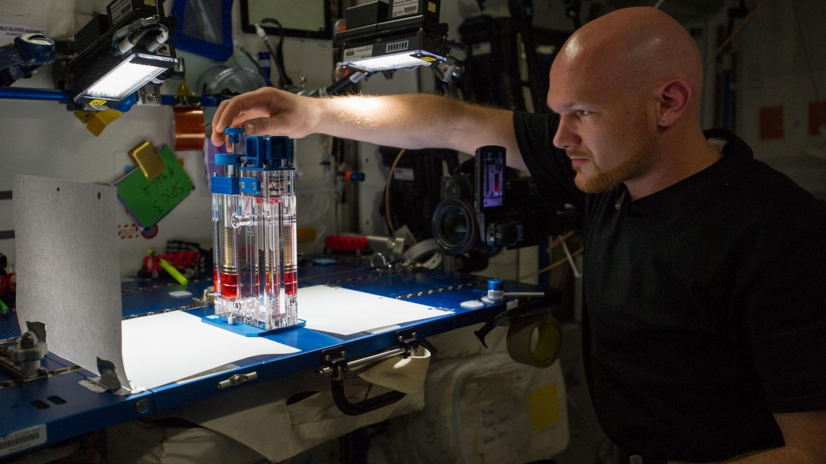ESA astronaut Alexander Gerst conducts a capillary flow experiment in space