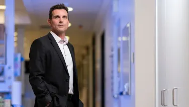 Man in the hallway of a hospital