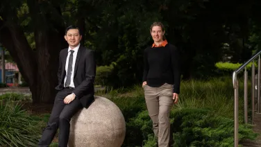 Two researchers pose