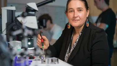 Woman by a microscope