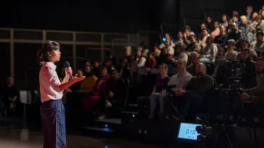 Speaker at three minute thesis