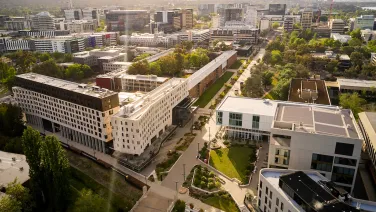 Aerial view of ANU campus, showing buildings, and looking towards Canberra city..
