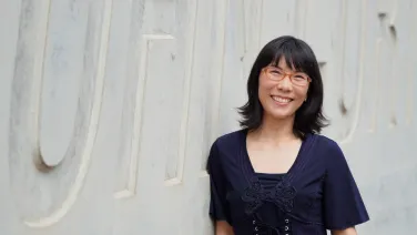 A woman looking at camera smiling