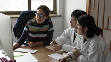 People looking at a computer