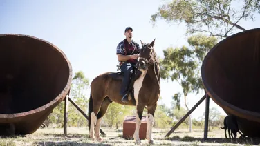 An man riding a horse