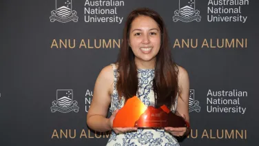 Woman holds trophy