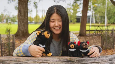 Woman with toy tasmanian devils