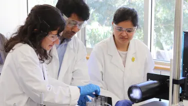 Three researchers in lab