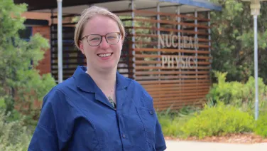Headshot of a woman outside nuclear physics building