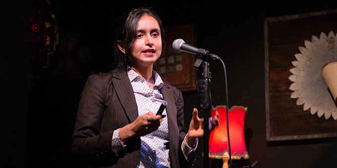 Women speaks into a microphone